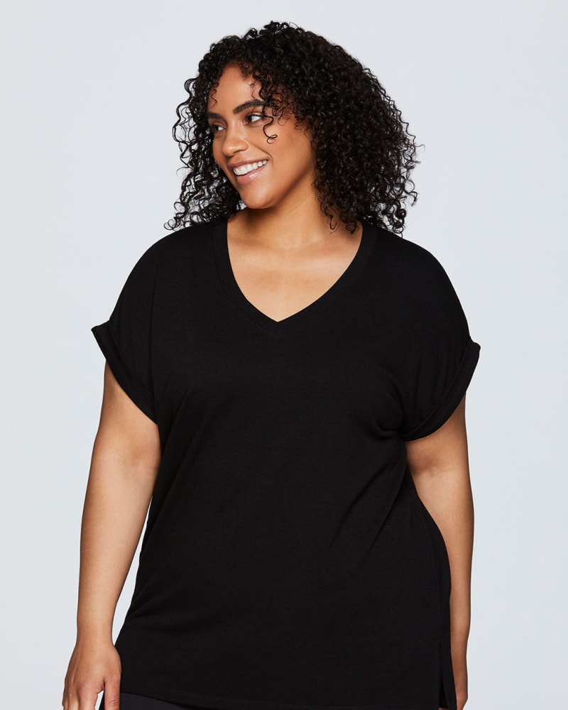 Front of a model wearing a size 1X Everyday V-neck Tunic in Black by RBX Active. | dia_product_style_image_id:244776